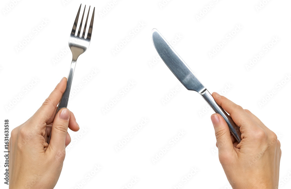 Fototapeta premium two hands holding a silver knife and a fork ready to eat