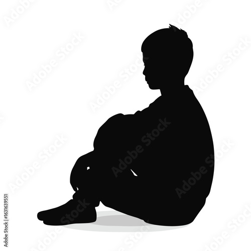 Silhouette of a sitting boy in contemplative pose on white background  