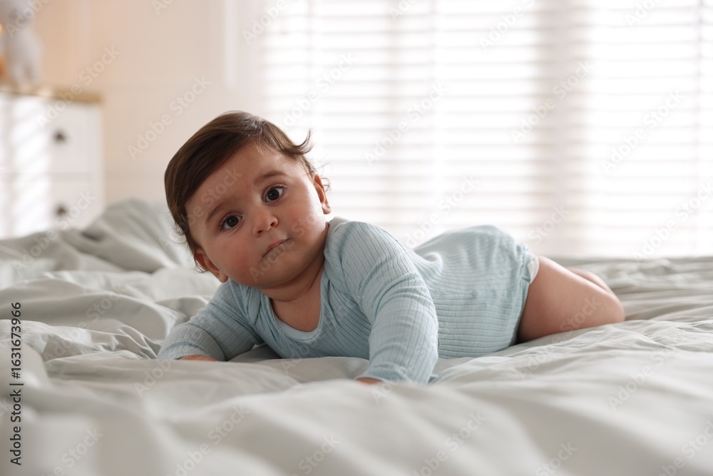 Cute little baby on bed at home Cute little baby on bed at home