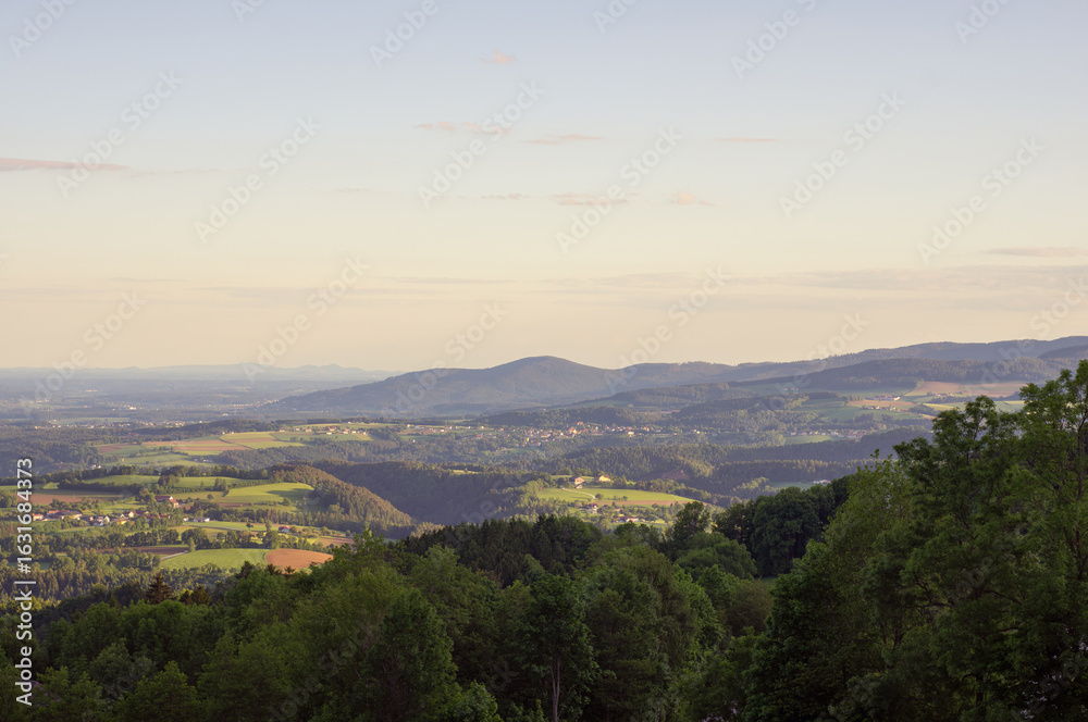 Fototapeta premium Captivating Golden Hour Landscape in Styria, Austria – Rolling Hills and Vast Horizons