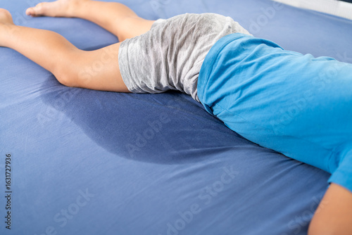 Pee on a bed mattress,Bed Wetting sleep enuresis in child, baby concept ,selected focus at wet on the bed sheet