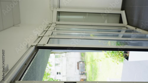 Wallpaper Mural Close up of automatic garage door lifting upward using remote control system illustrating smart home integration modern lifestyle and advanced motorized convenience. High quality 4k footage Torontodigital.ca