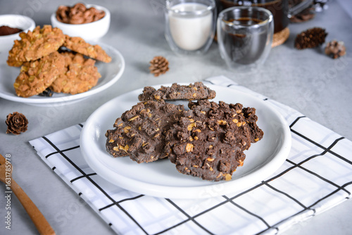 Flat Lay of Homemade Cookies and Coffee with Milk on Gray Table.