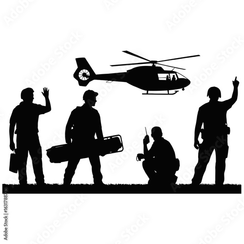 Silhouette of paramedics and a helicopter
