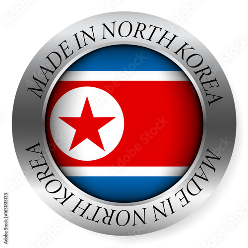 Made in North Korea button icon. Circular emblem with metallic border, glossy central flag, and bilingual label indicating product origin and international manufacturing identity.