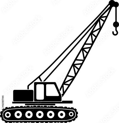 Construction crane lifting cargo at industrial site with clear blue sky silhouette