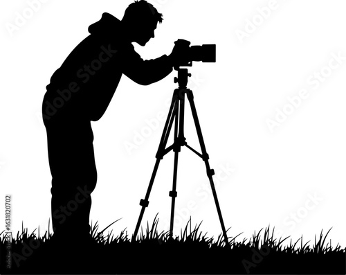 Silhouette of a Photographer with Camera on Tripod in Nature