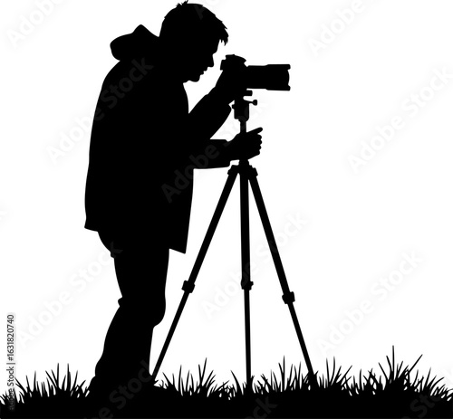 Silhouette of a Photographer with Camera on Tripod in Nature