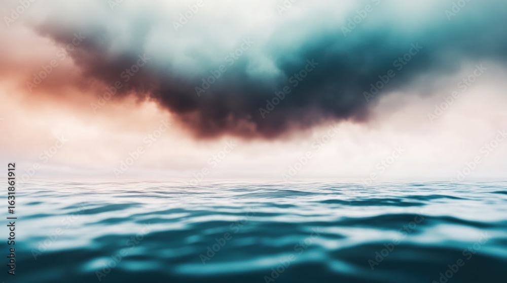 Obraz premium Moody clouds gathering over calm ocean waters at sunset on a serene evening