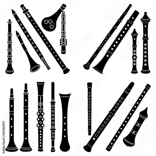 Collection of various black and white wind instruments including oboes and clarinets in different sizes