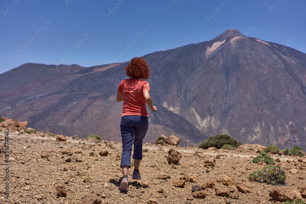 Fototapeta premium Woman trail running near Teide