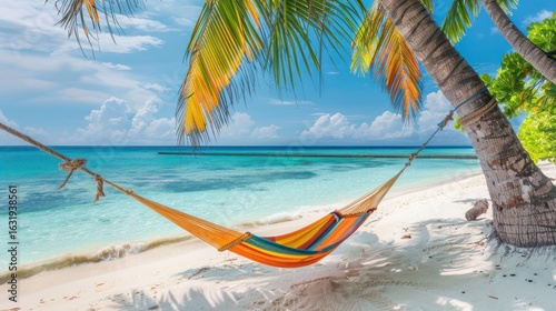 Wallpaper Mural Secluded tropical beach escape with vibrant hammock between palm trees offering relaxation Torontodigital.ca