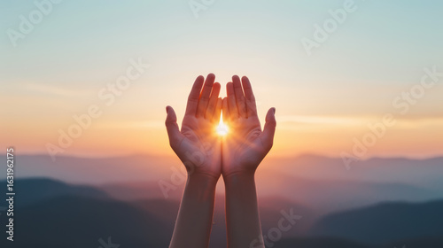 A person's hands are open to the sun, symbolizing peace and hope