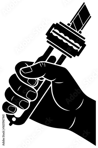 Razor fashion tool being held in a hand with a sharp edge near a mirror