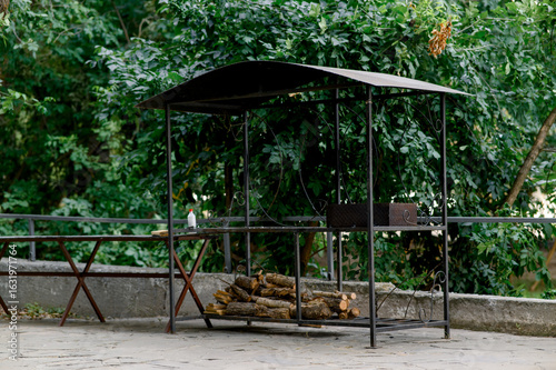 Wallpaper Mural Barbecue area. Metal structure with barbecue and woodpile Torontodigital.ca