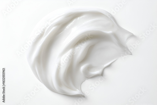 A luxurious smear of thick white cosmetic cream with a smooth, glossy texture on a plain white background.