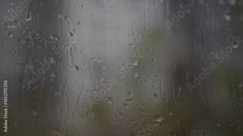 Rainy day in Recoleta, Buenos Aires: gray urban landscape filmed from an apartment. Wet streets, overcast sky, and construction in the rain. Detailed shots with interior references. 