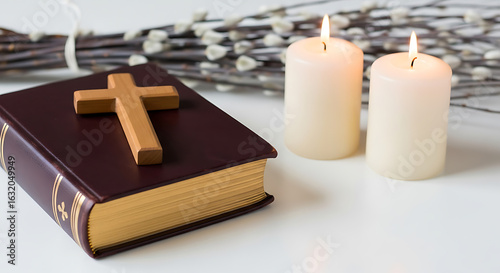 Serene christian still life composition featuring a bible candles and pussy willow branches
