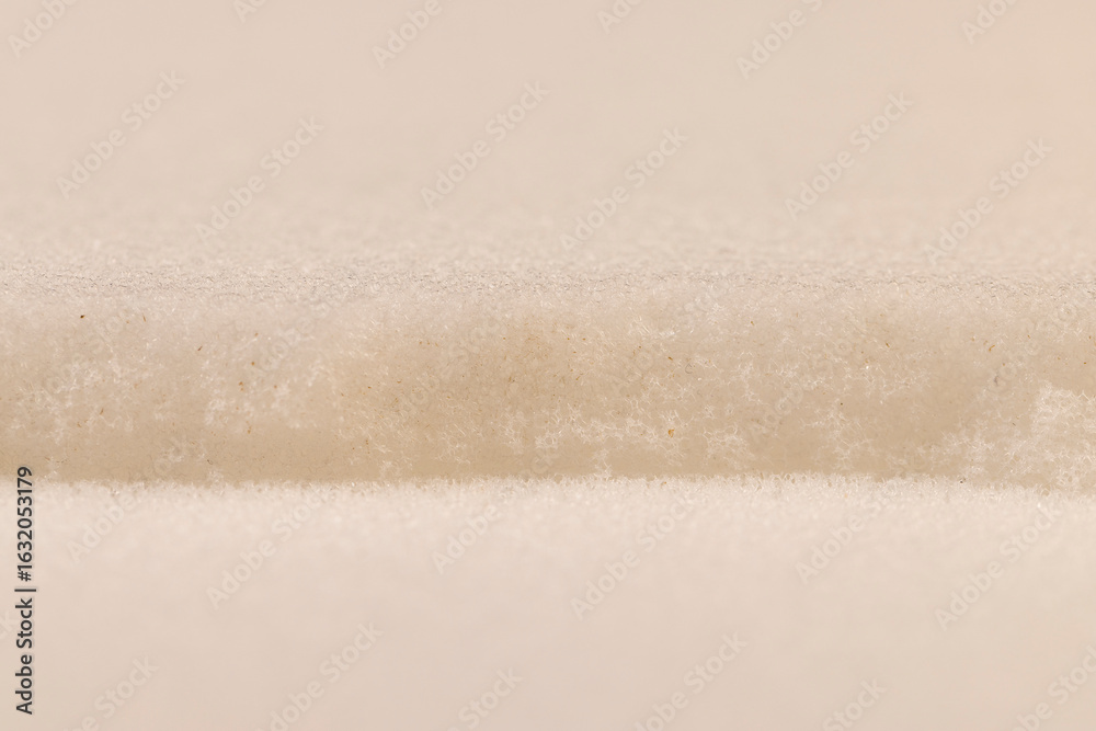 Fototapeta premium old dirty white foam for storing and transporting fragile goods close up, white foam porous structure is old and dirty after use and long-term operation