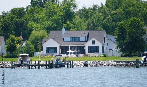 A waterfront property with a boat dock on the stone seawall near St Michaels, Maryland, U.S.A