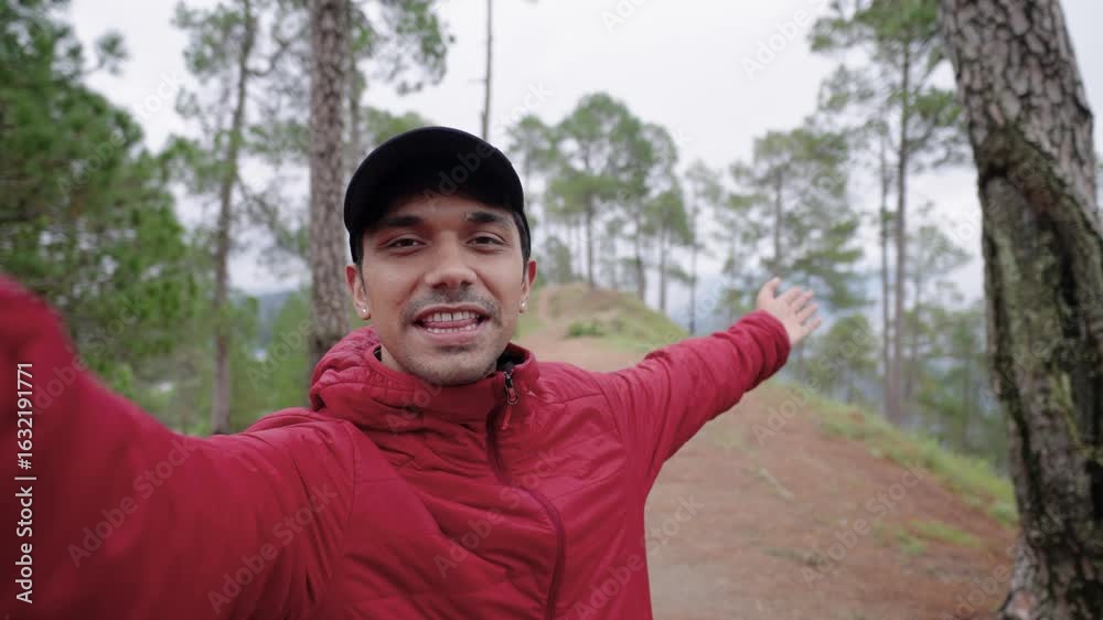 Young Indian man vlogging in the mountains, talking directly to the camera with natural landscape in background, 4k video Young Indian man vlogging in the mountains, talking directly to the camera with natural landscape in background, 4k video