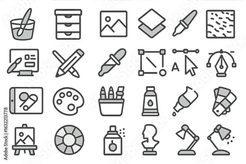 Collection of artistic tools and design elements for creative projects in a workspace setting