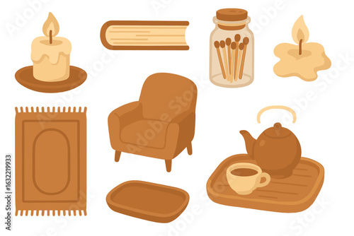 Cozy home decor elements for a warm atmosphere with candles, books, and a comfy chair