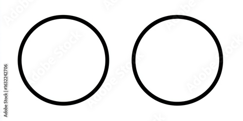 Two solid black circles against a white background