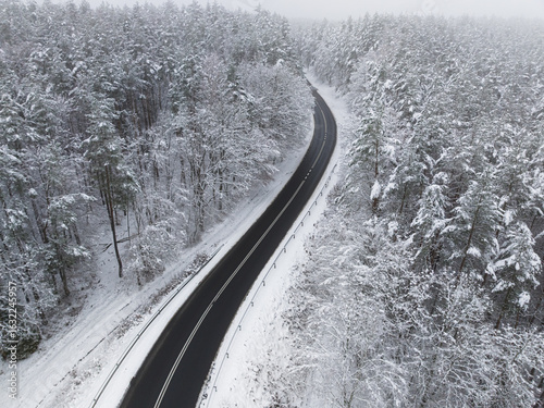 Snowy road leading through ...