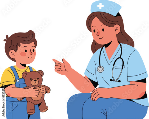 A friendly female nurse in a blue uniform gently talks to a young boy holding a teddy bear.