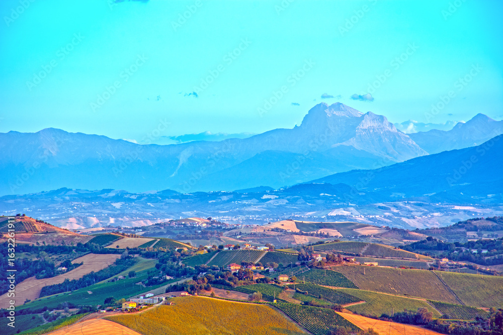 Fototapeta premium Landscape in Italy at sunset, Marche, Gran Sasso in Background