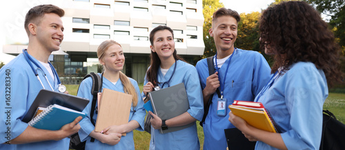 Group of medical students in uniforms near building outdoors