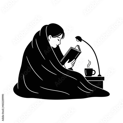 A person wrapped in a blanket reading a book next to a lamp and a mug on a bedside table