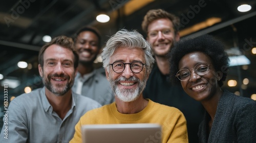 Diverse multigenerational team smiling together at office