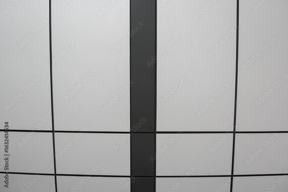 Obraz premium Gray and Black Panelled Wall or Ceiling Geometric Design.