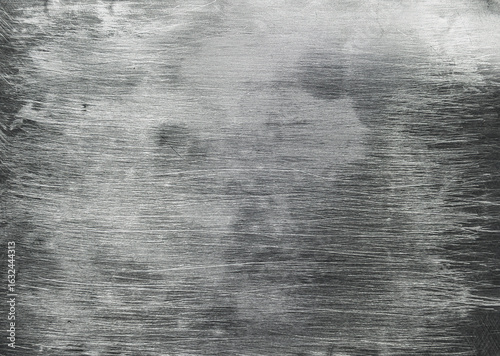 Brushed metal texture creating a stunning industrial background.Aluminum surface provides a textured and industrial backdrop, perfect for design projects seeking a raw and metallic aesthetic
