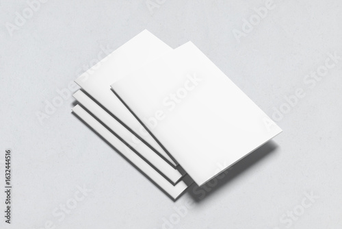 Four blank A4 or A5 magazine brochure mockups presented on a white background. 3D rendering