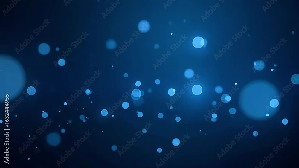 Dynamic abstract blue bokeh particles gently floating, creating a mesmerizing and serene atmosphere for motion graphics.
