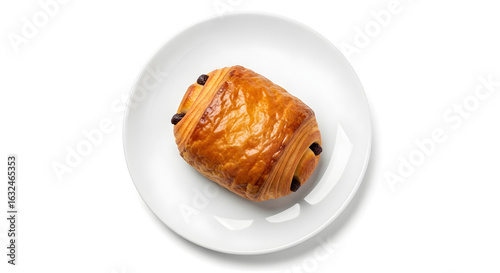 Freshly baked pain au chocolat on white plate