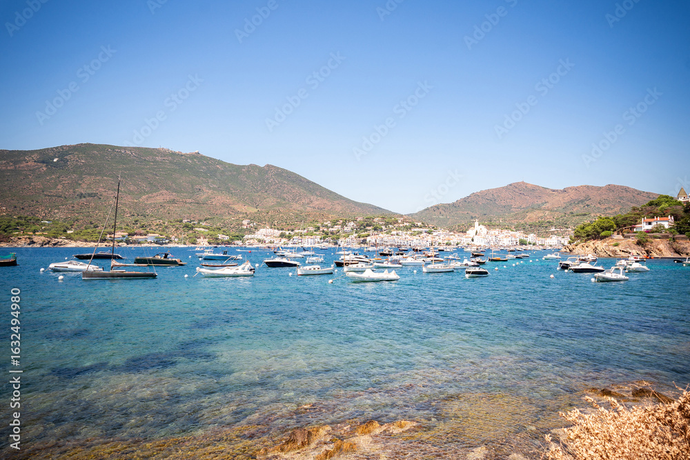 Obraz premium View of the sea and boats in Cadaques, Spain. Beautiful coastal landscape in Costa Brava