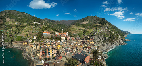 Panorama of Vernazza in the bay among terraced vineyards with brightly colore...
