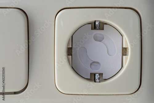 child safety lock with rotating mechanism in wall socket