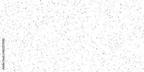 Abstract mosaic pattern in shades of gray creating a textured surface with a random scattered effect on a white background