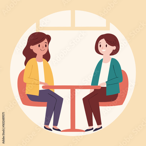 Two women sitting at a table discussing something