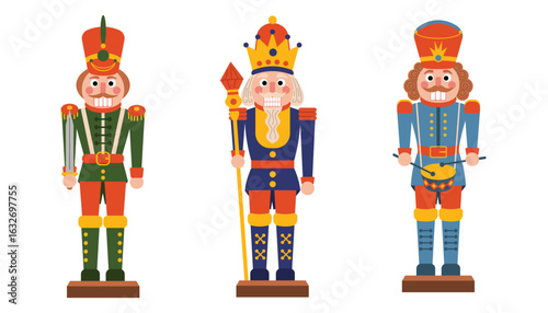 Set of three Christmas nutcracker toy soldiers in red, green and blue uniforms.