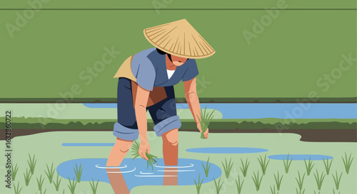A farmer wearing a conical hat diligently plants rice seedlings in a flooded paddy field under a clear sky.