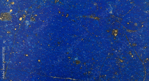 Abstract blue and gold texture, reminiscent of deep space or a precious stone surface.
