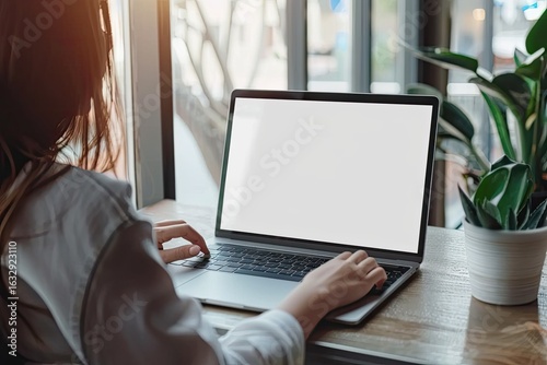 Vibrant Color Image of Businesswoman Working on a Blank Laptop