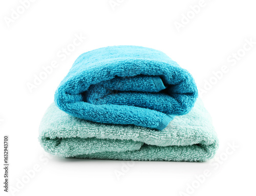 Folded soft towels isolated on white. Home textile