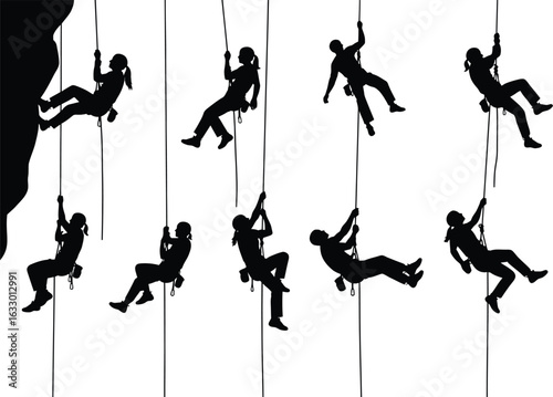 Diverse group of silhouetted rock climbers rappelling down a sheer cliff face in dynamic poses